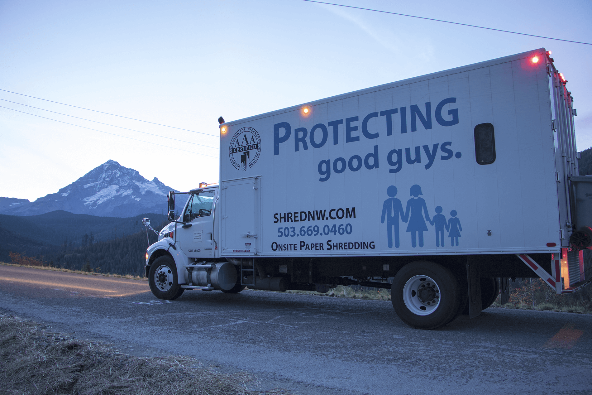 Shred Racism: Mobile Shred Truck with artwork "protecting good guys".